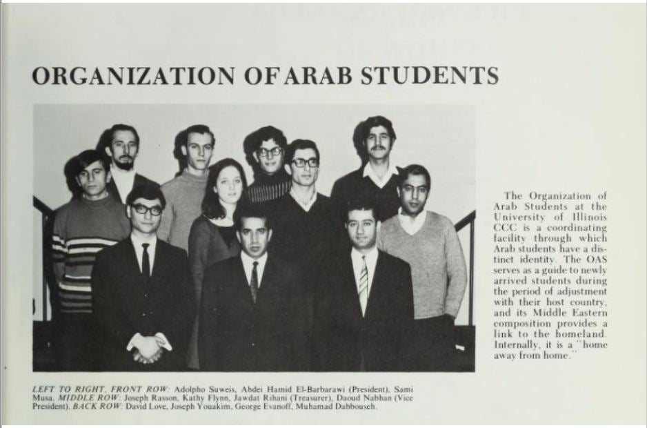 A print newsletter clipping that contains a black and white photograph from the 60s with a number of students wearing winter clothes, suits and ties, sweaters standing in three rows posing for a photograph and a written text on the right side describing who they are